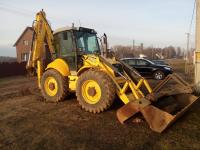 Экскаватор-погрузчик New Holland LB 115 b вес 9500 кг. Вилы, гидромолот.